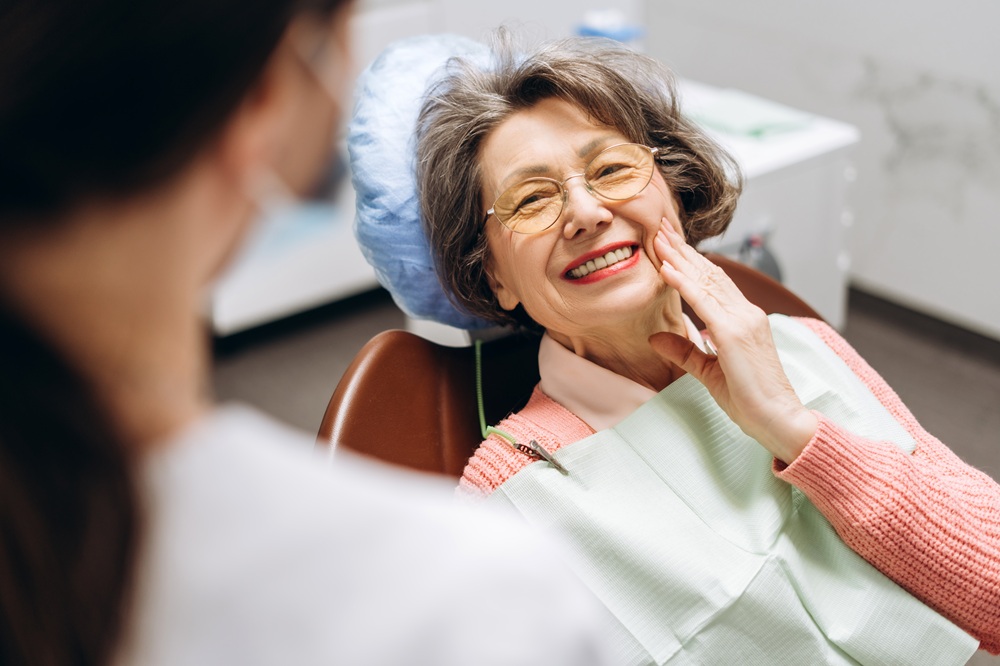 All-On-X Implants in Irvine: Senior Patient Smiling During Her Visit Senior dental patient smiling during her appointment at our Irvine dental office
