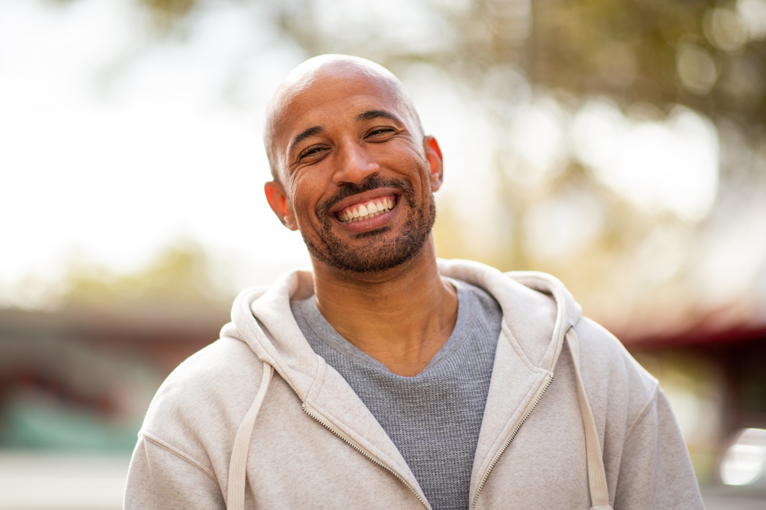 Healthy Smiles in the Irvine Community Smiling man outdoors representing healthy smiles and dental wellness in the Irvine community